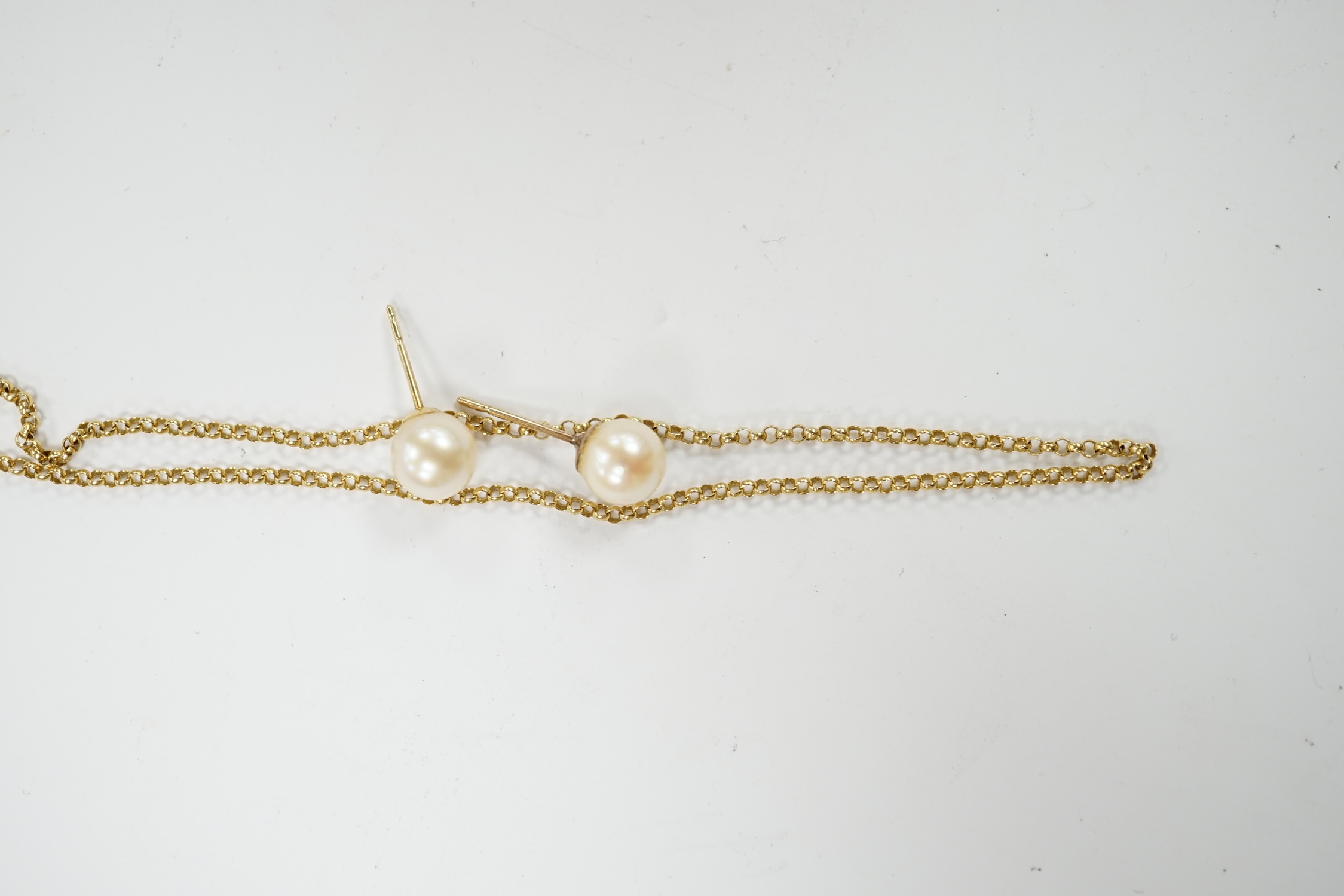 An 18ct gold fine link chain, 43cm, 3 grams and a pair of 18k and cultured pearl set ear studs. Condition - fair